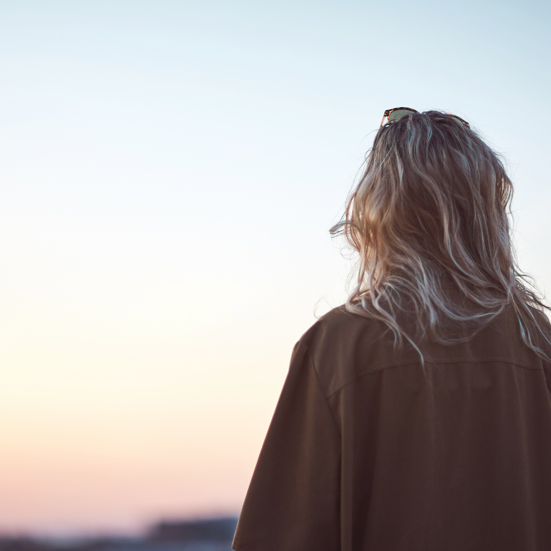 strong woman looking out at and seeing beauty